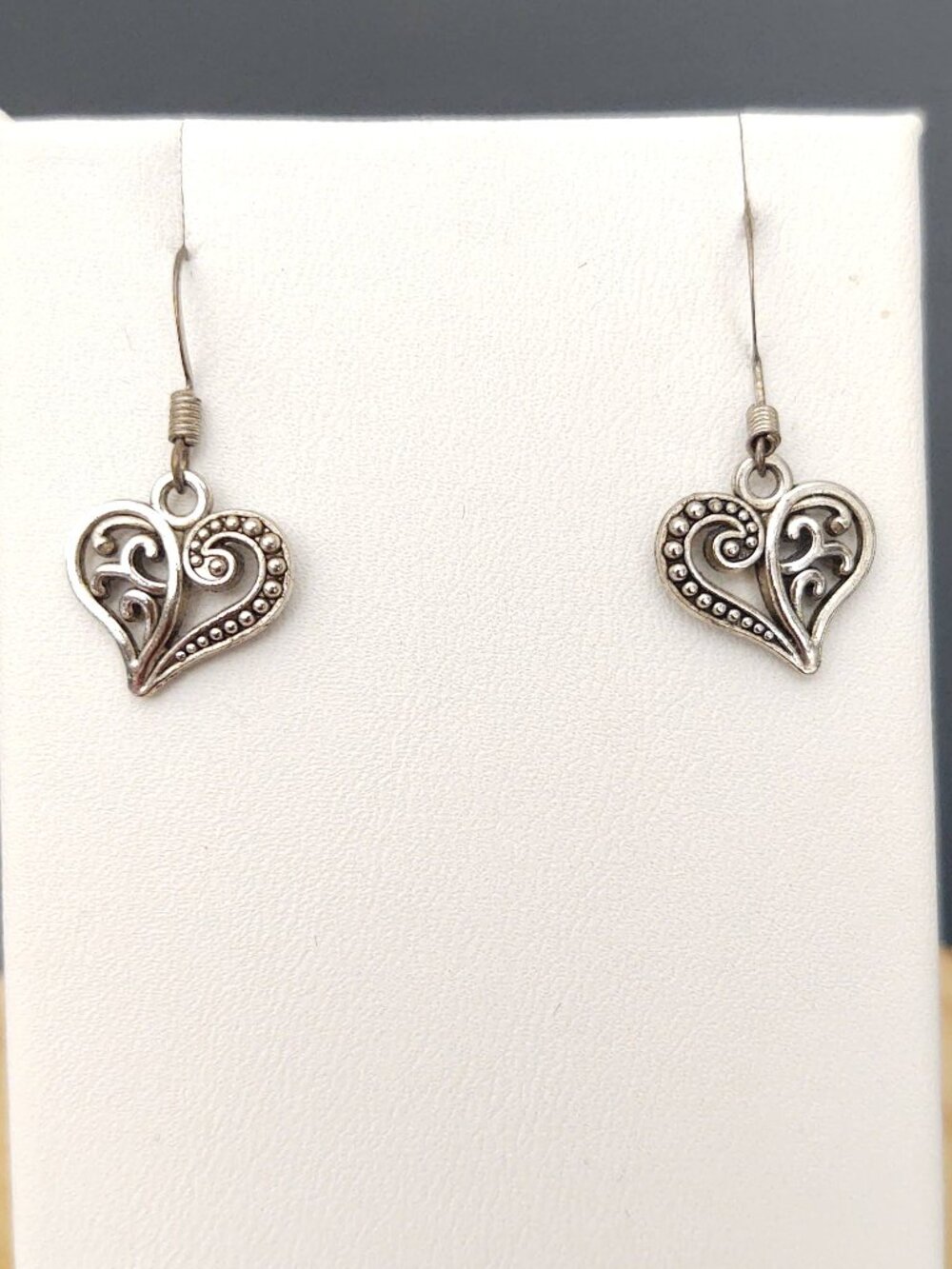 Silver tone small open heart dangle earrings